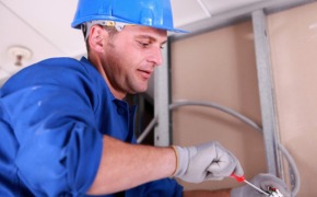 close up of commercial electrical contractors at work